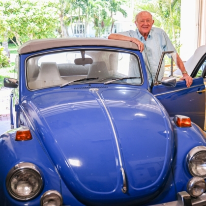 Rutgers Alumnus Thomas Ambrose GANB'51 with his Volkswagen Beetle